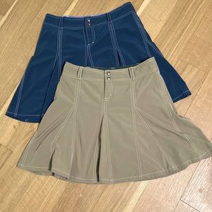 Pair of Athleta women’s skorts. Size small, 4 petite 4P. Tan and blue.